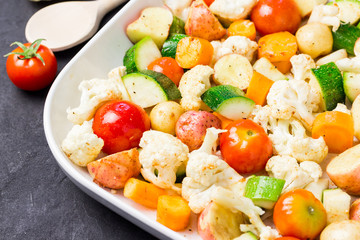 Raw vegetables in a baking dish.  Selective focus, close up, copy space.