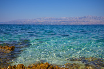 Obraz premium Adriatic Sea Croatia Europe. Beautiful nature and landscape photo. Warm hot summer day. Water, reef, rocks, stones and water