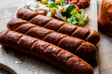 Frankfurter Grilled Sausages with salad and salsa sauce.