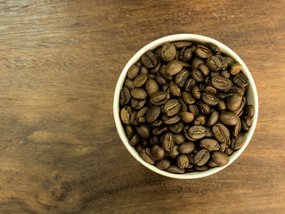 Coffee milk with coffee bean on wood table