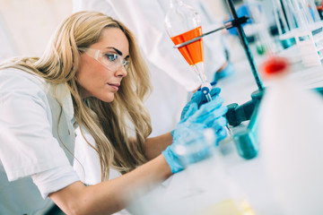 Female student of chemistry working in laboratory