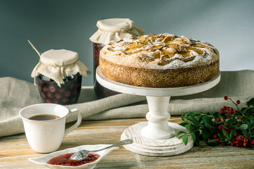 Apple pie and desserts on the table. Tea party in a rustic style. Sweet autumn still life