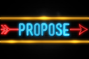 Propose  - fluorescent Neon Sign on brickwall Front view