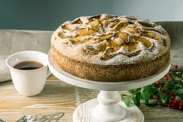 Apple pie and desserts on the table. Tea party in a rustic style. Sweet autumn still life
