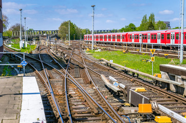 Multiple Railway Track Switches at a Major Train Station on a Sunny Spring Day