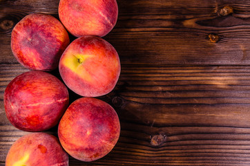 Fresh ripe peaches on wooden table. Top view