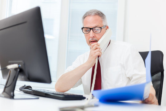 Senior Manager At Work In His Office