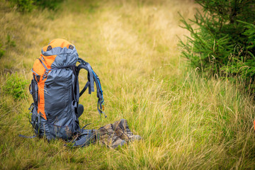 backpacks in the mountains on a sunny summer day