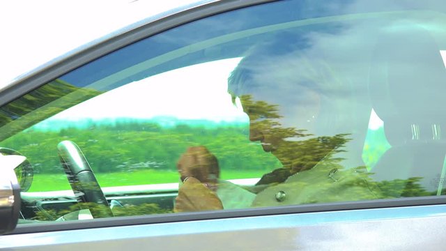 Middle Aged Woman Sweats In The Car - Too Hot Weather - Car Stands On The Verge Of Road In Countryside 