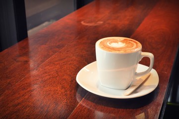 white cup of hot coffee in coffee shop 