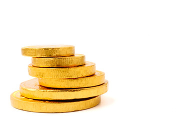 Gold coin stack on a white background. Free space for text