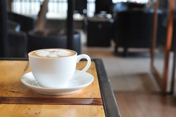 Coffee cup in coffee shop,Cup of coffee on a wooden table,cup of coffee on table in cafe,cup of cappuccino