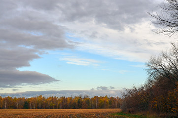 Autumn stubblefields under a sunny and stormy weatherfront