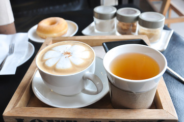 Coffee cup in coffee shop,Cup of coffee on a wooden table,cup of coffee on table in cafe,cup of cappuccino