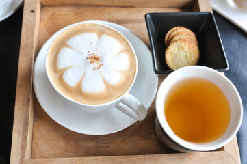 Coffee cup in coffee shop,Cup of coffee on a wooden table,cup of coffee on table in cafe,cup of cappuccino