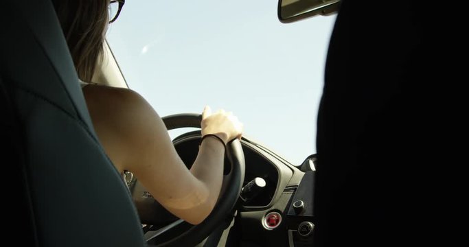Woman driving - from back seat - slow motion