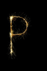 English alphabet from sparkler on black background,Alphabet big letter