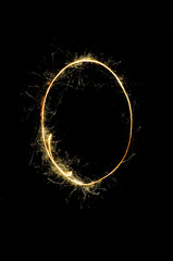 English alphabet from sparkler on black background,Alphabet big letter
