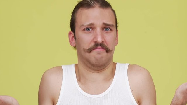 thin man with blue eyes showing surprise and expressing lack of information closeup. Concept of emotions 