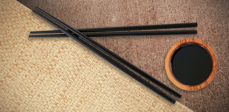 Composite image of close up of black chopsticks
