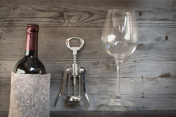 Red wine bottle,corkscrew,glass. Top view still life