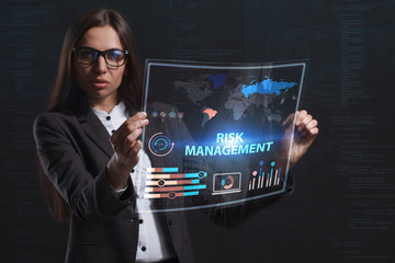 The concept of business, technology, the Internet and the network. A young entrepreneur working on a virtual screen of the future and sees the inscription: Risk management