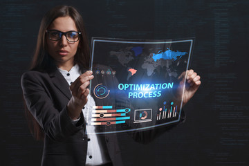The concept of business, technology, the Internet and the network. A young entrepreneur working on a virtual screen of the future and sees the inscription: Optimization process