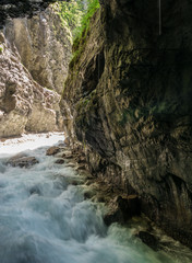 Fototapeta na wymiar The river in Partnach Gorge of mountains in Bavaria, Germany