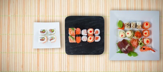 Composite image of close up of seafood and sushi served in plate