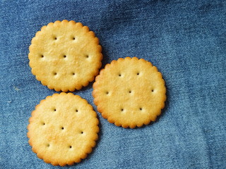 crackers on jeans background