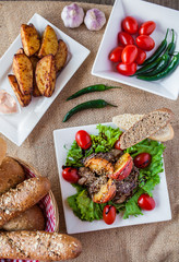 meat plate with sauces and bread for lunch