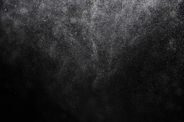 Snowstorm texture,Water dust in motion like snow on black,Watercolor background