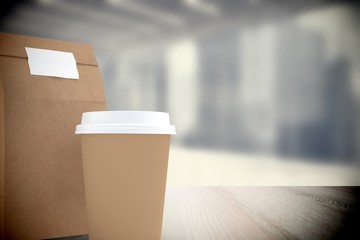 Composite image of disposable coffee cup and parcel bag 