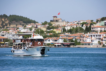 a tourist ship with stone windmill in Ayvalik, Turkey