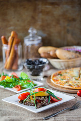 Pizza with meat salad