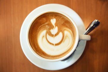 cappuccino coffee on wood background