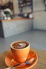 cappuccino coffee on wood background