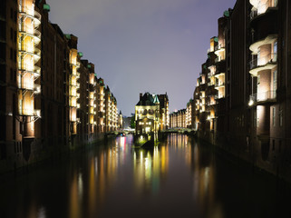 illuminated historic buildings in the old warehouse district Speicherstadt in Hamburg, Germany