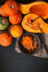 pumpkin with seeds on a wooden background