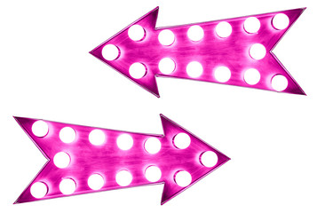 Two pink vintage bright and colorful illuminated metallic display arrow signs with light bulbs against a seamless white background