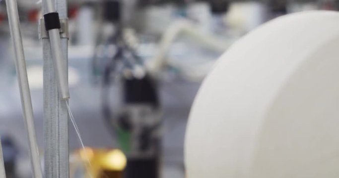 Industrial knitting machine producing cotton yarn