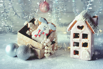 Magical winter christmas picture. Gingerbread house with snow.