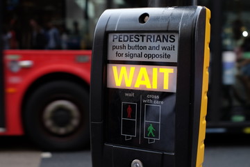 "Wait" signal at a pedestrian crossing in London with traffic