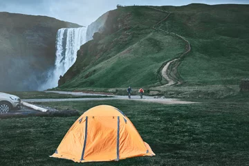 Foto op Plexiglas camping near famous Skogafoss waterfall in southern Iceland. treking in Iceland. Travel and landscape photography concept © vitaliymateha