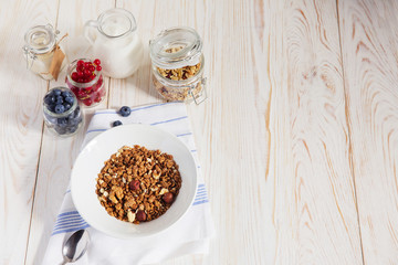 healthy breakfast homemade baked granola or muesli with fresh blueberries white background