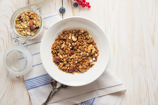 healthy breakfast homemade baked granola or muesli with fresh blueberries white background