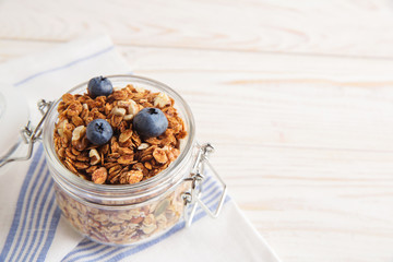 healthy breakfast homemade baked granola or muesli with fresh blueberries white background
