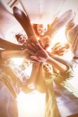 Obraz premium Directly below portrait of smiling business people stacking