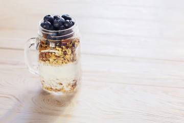 healthy breakfast homemade baked granola or muesli with fresh blueberries white background
