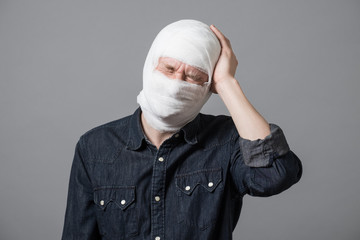 Man with bandage on his head